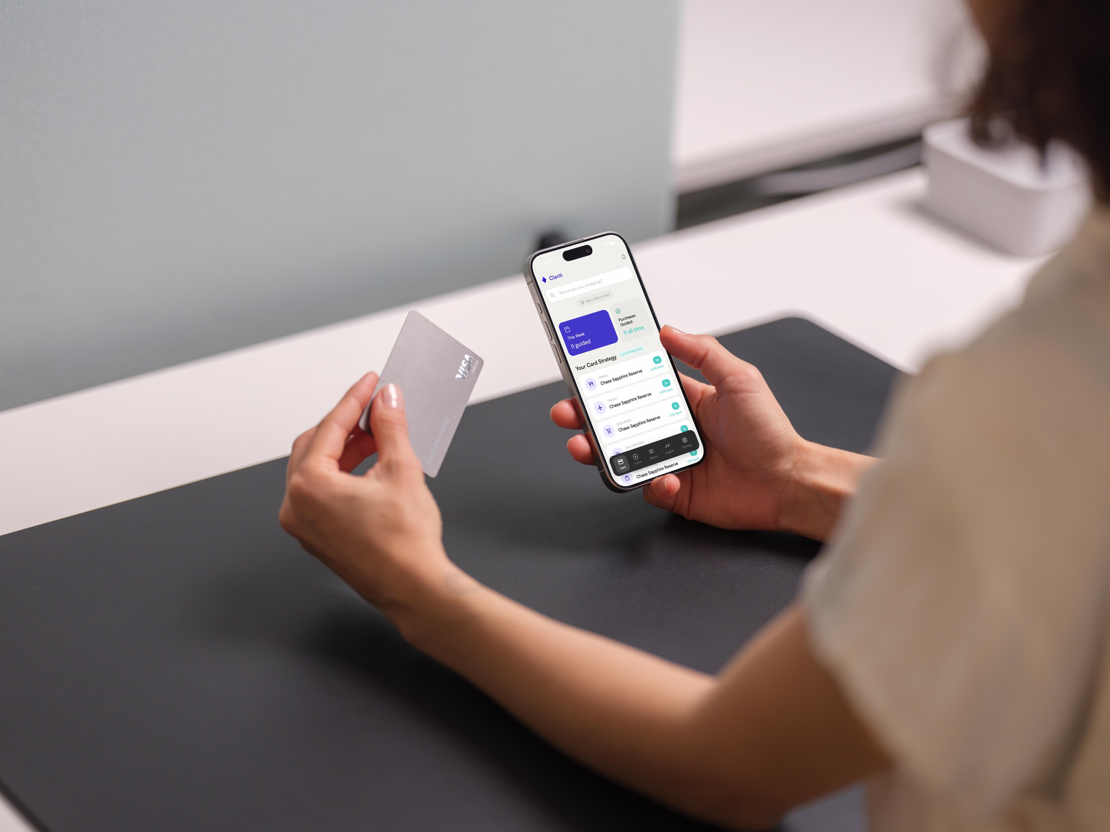 Person using Clariti app to choose the best credit card at checkout